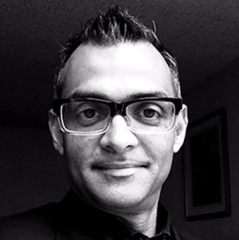 Prasad Boradkar wearing glasses facing camera